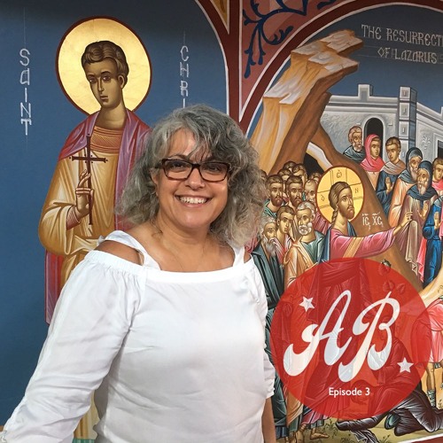 Woman in front of christian mural