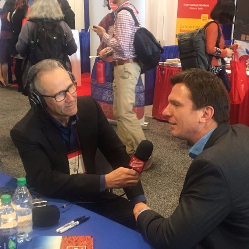 Steve Leveen interviewing Bill Weir, mike in hand